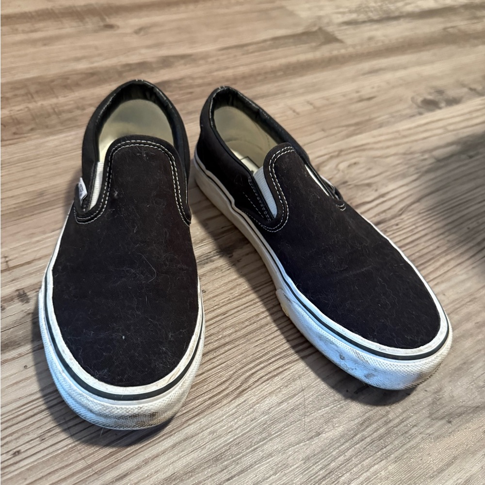 Vans Black and White Slip-On Sneakers
